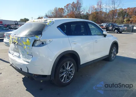 2021 Mazda Cx-5 Grand Touring z USA, uszkodzony, nr VIN JM3KFBDMXM0468606